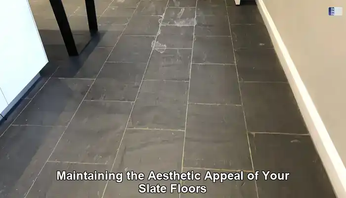 Patchy slate floor with pale worn areas beside darker protected tiles